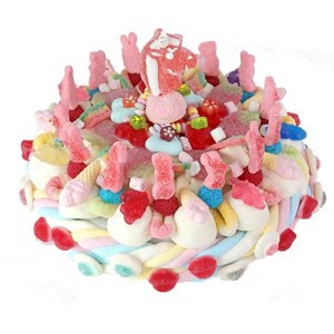 gâteau de bonbons sur le thème de la licorne et de l'arc en ciel.